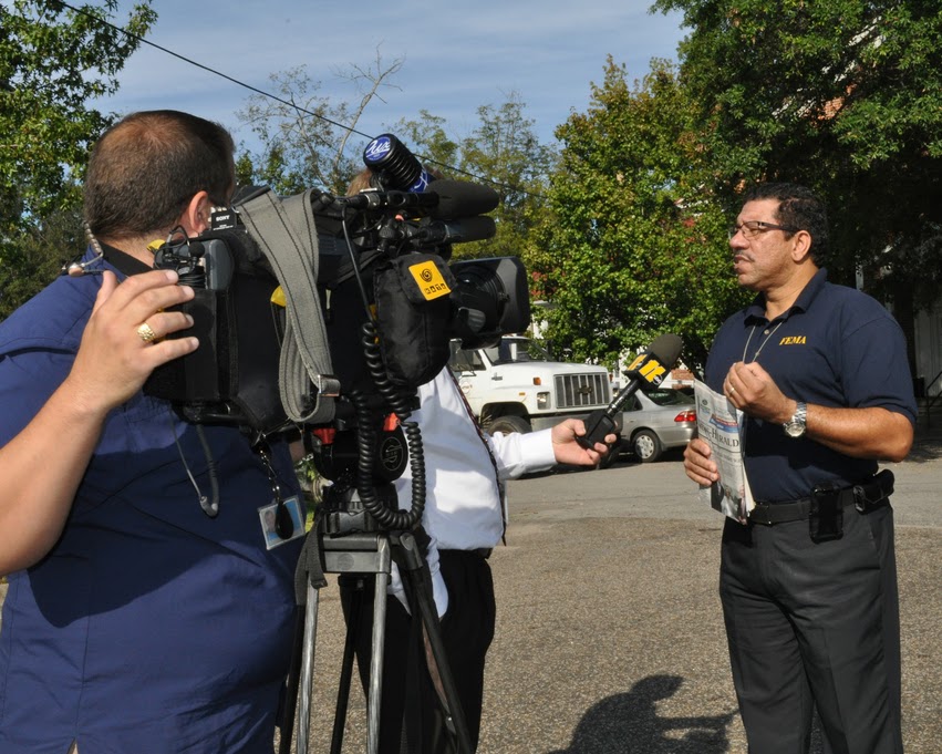 man talking to a news camera